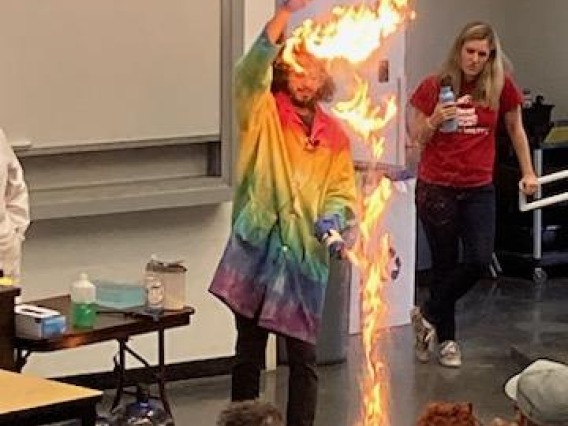 Flames jump close to 6 ft in the air during a chemistry magic show