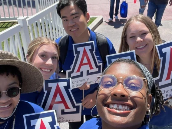 5 CBC students smile for a selfie and hold the UArizona "A"