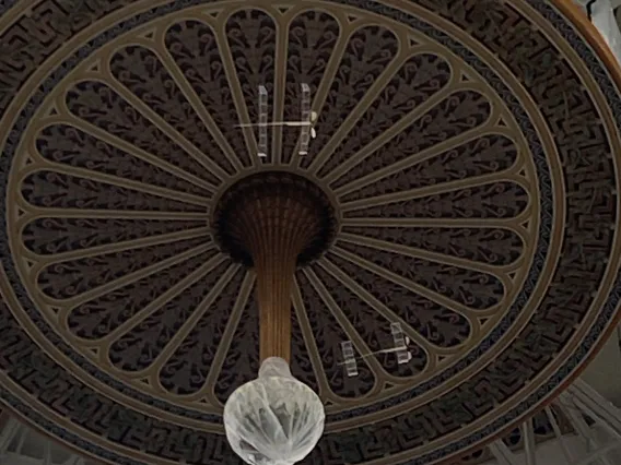 zoomed in photo of two planes flying near the ceiling of the West Baden Springs hotel in Indiana