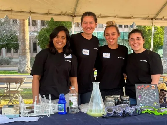 Group of PAWS members at a booth