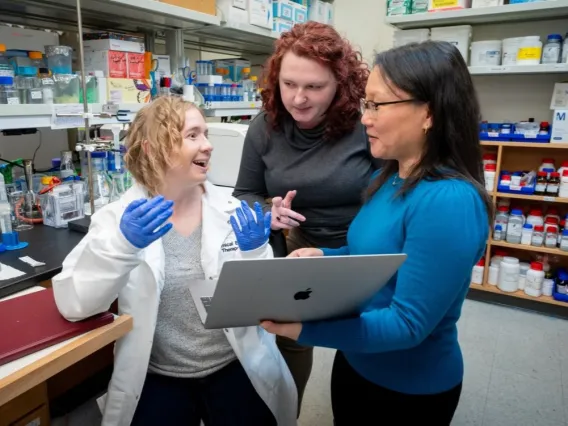 Sarah Young, on the far left collaborating with other scientists