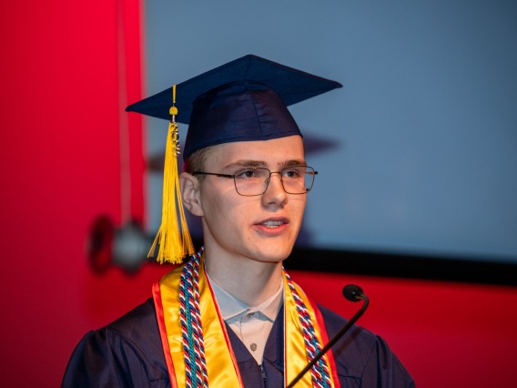 Facial closeup of Caleb Seekins while speaking during the W.A Franke Honors College Outstanding Senior award ceremony