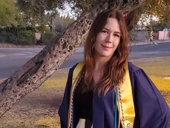 Caroline Coppinger wearing a graduation gown