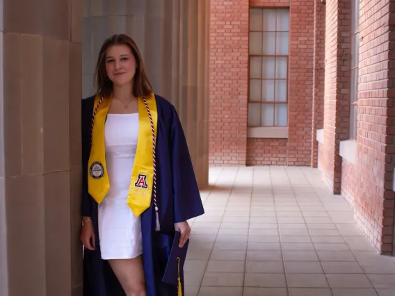 Clare Hotze wearing a graduation gown