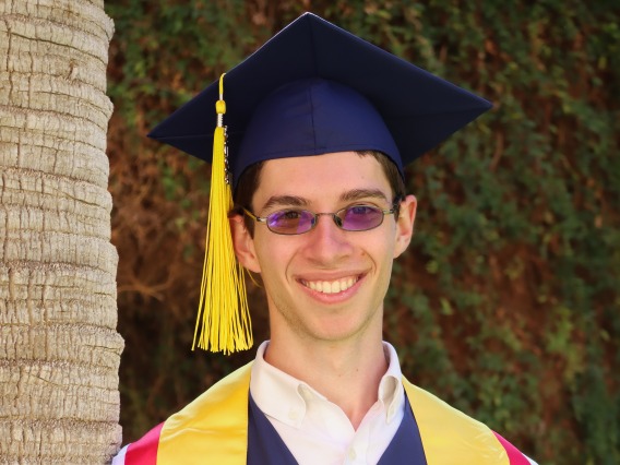 David Jurkowitz wearing a graduation cap and gown