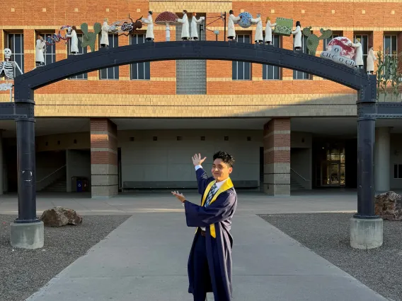 Julio Camacho wearing a graduation gown