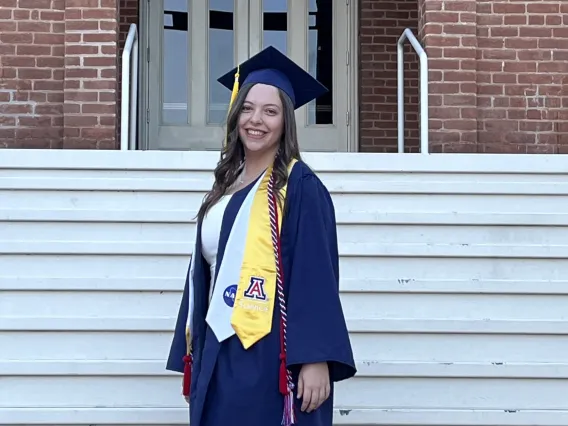 Kristen Roehling wearing a graduation cap and gown