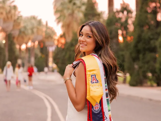 Lisette Montano holding a graduation cap