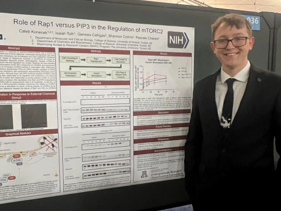 photo of Caleb Konecek and his research presentation poster at ABRCMS