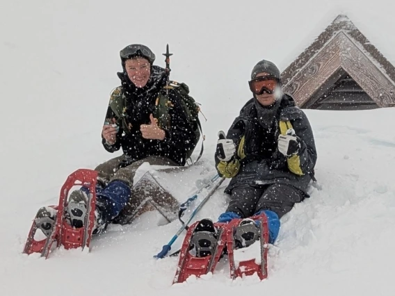 Anna Campbell and Ika Lin on snow sleds