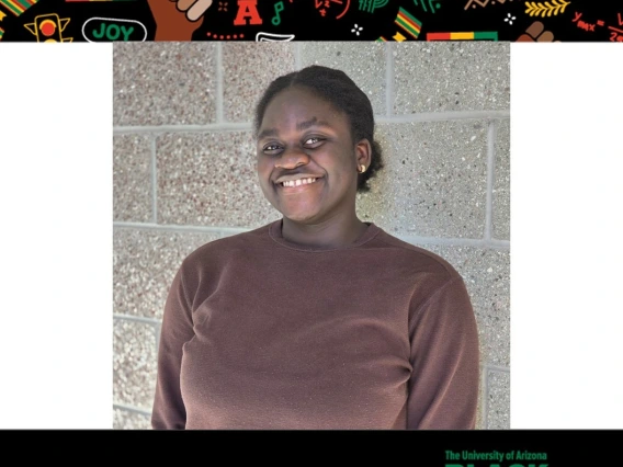 Photo of Abena Oduro-Gyaminah with Black History Month banner