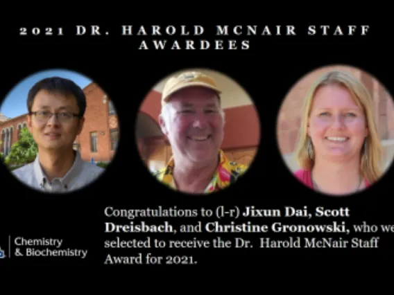 Staff Jixuan Dai, Scott Dreisbach and Christine Gronowski smiling as they are awarded