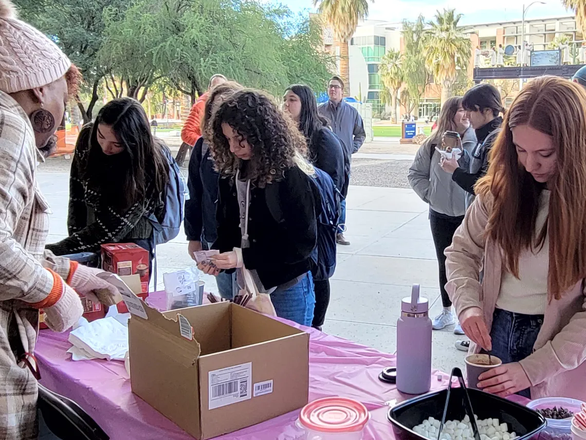 Students adding all the toppings at Cookies and Coco with CBC