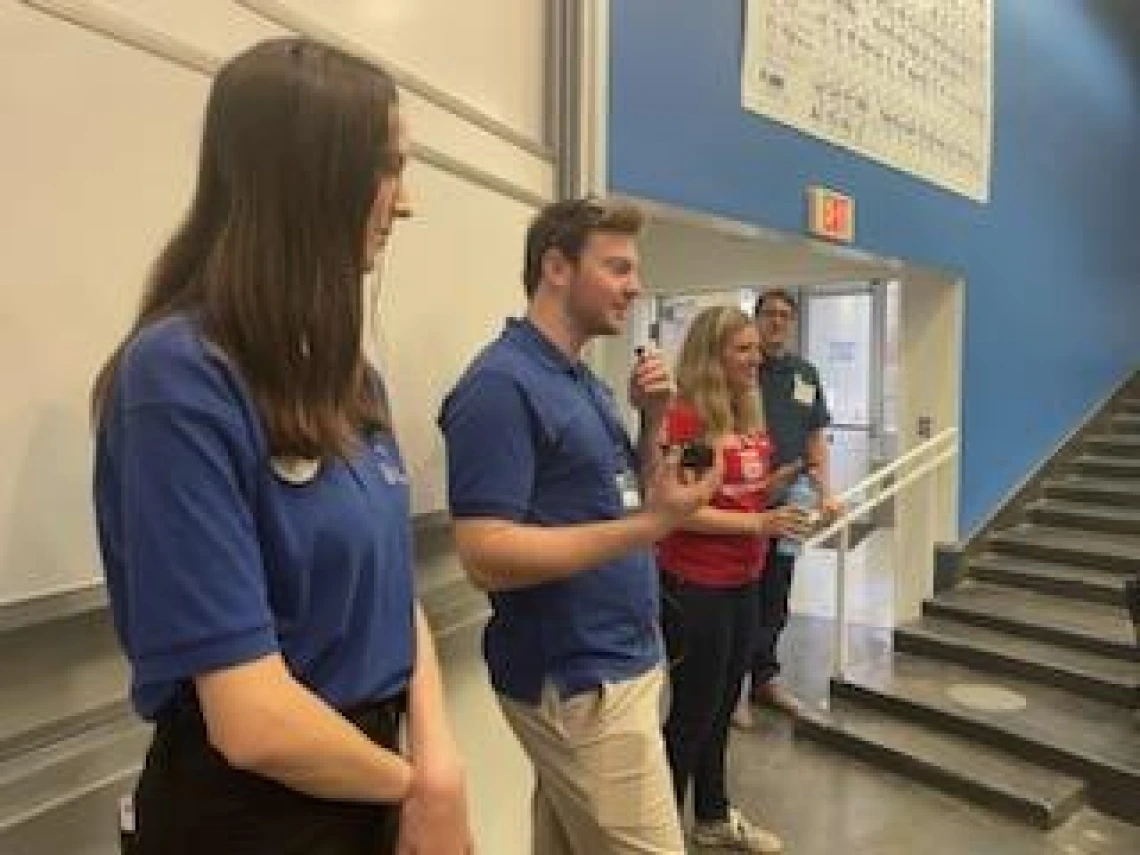 CBC staff speak during a chemistry magic show in Koffler building