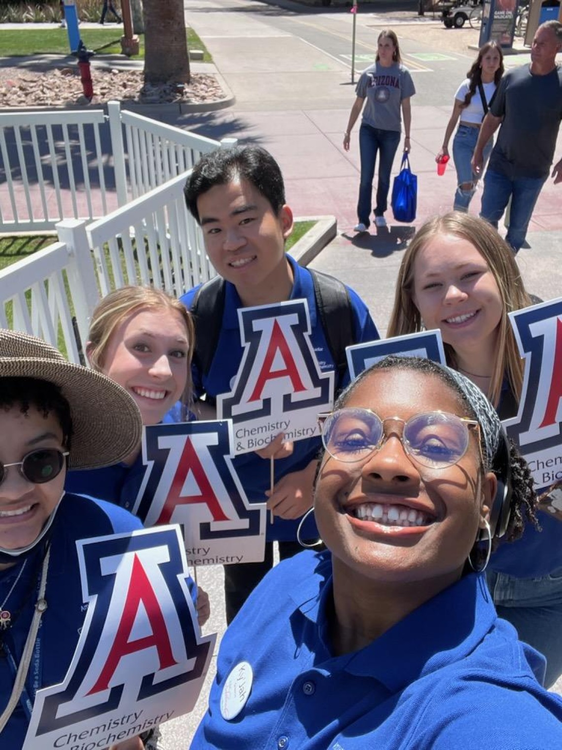 5 CBC students smile for a selfie and hold the UArizona "A"