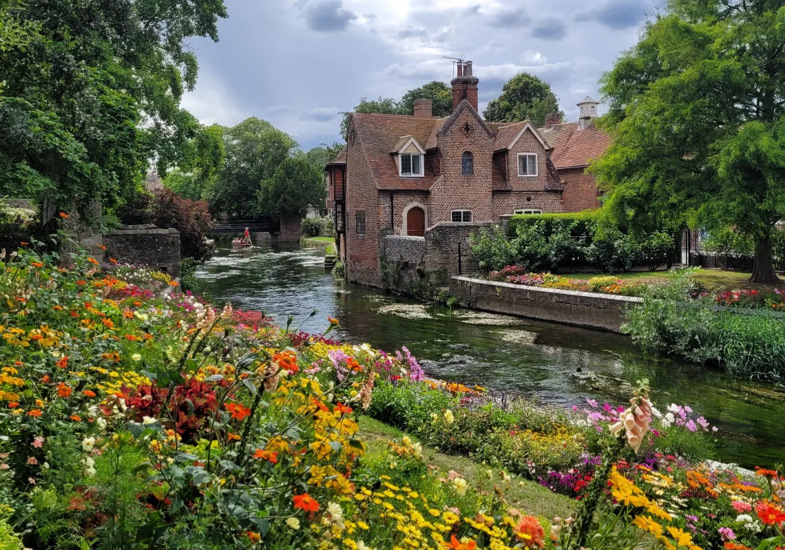 Photo of large brick house by a river taken by Ananya Chakraborti