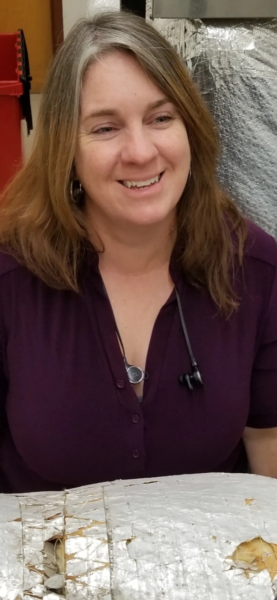 Jennifer Autz smiling in a lab