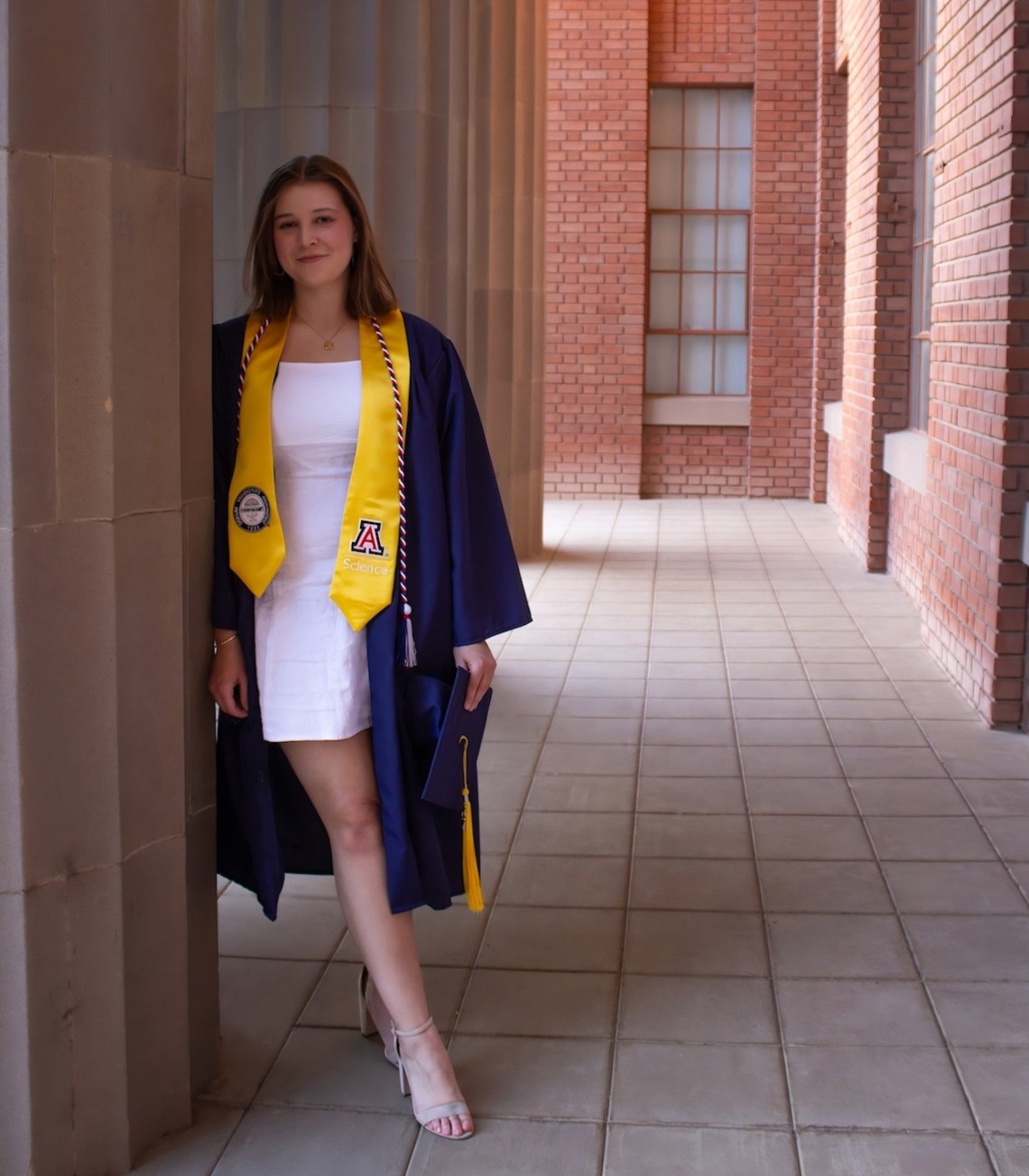 Clare Hotze wearing a graduation gown