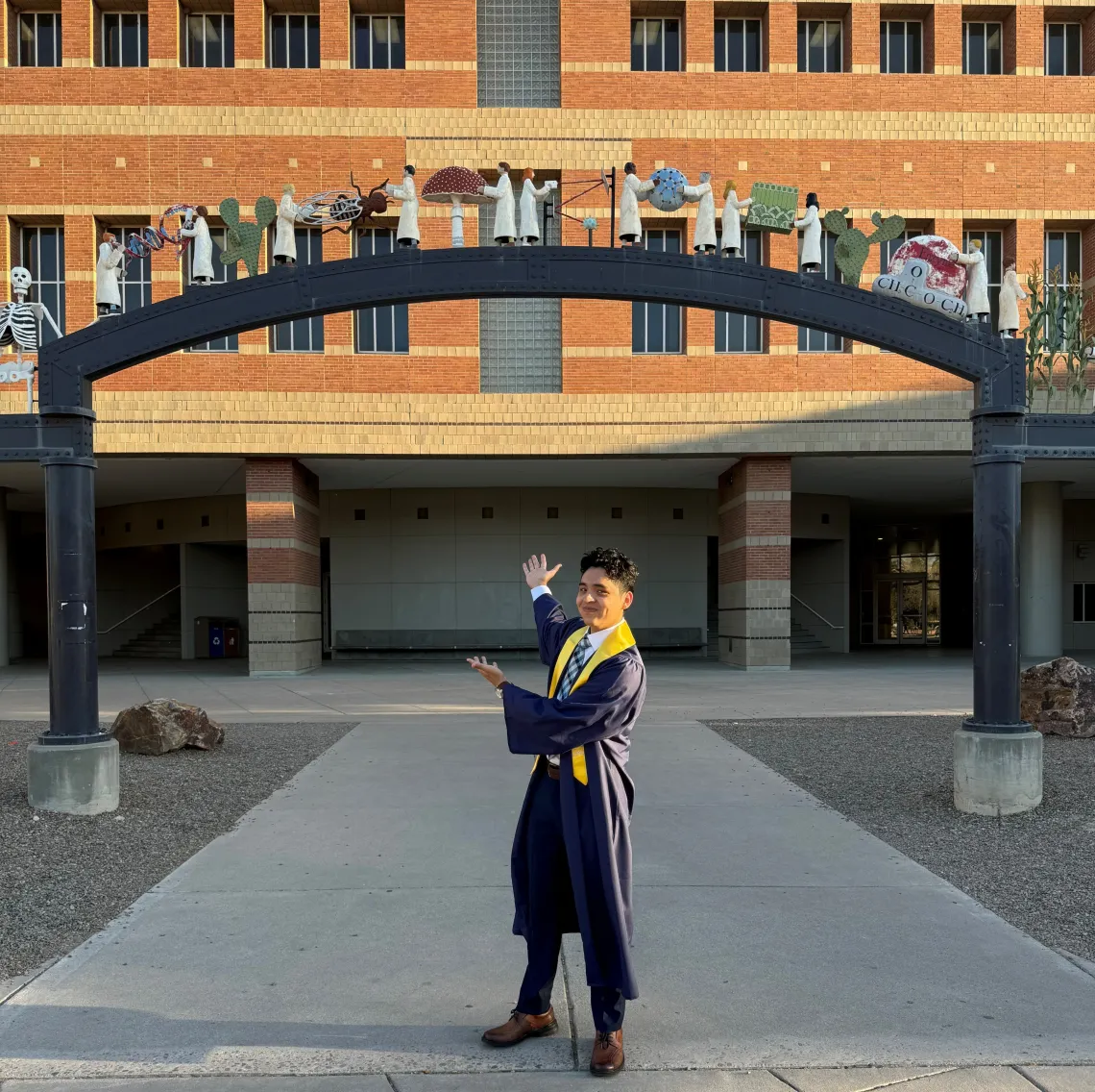 Julio Camacho wearing a graduation gown