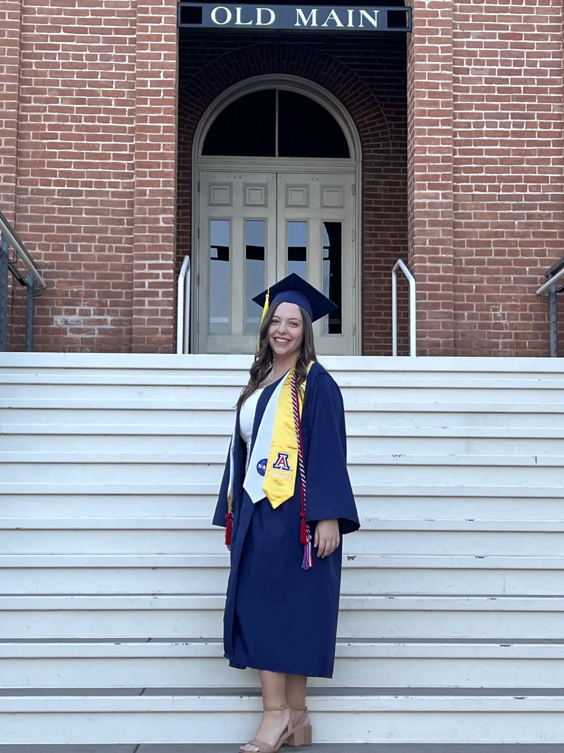 Kristen Roehling wearing a graduation cap and gown