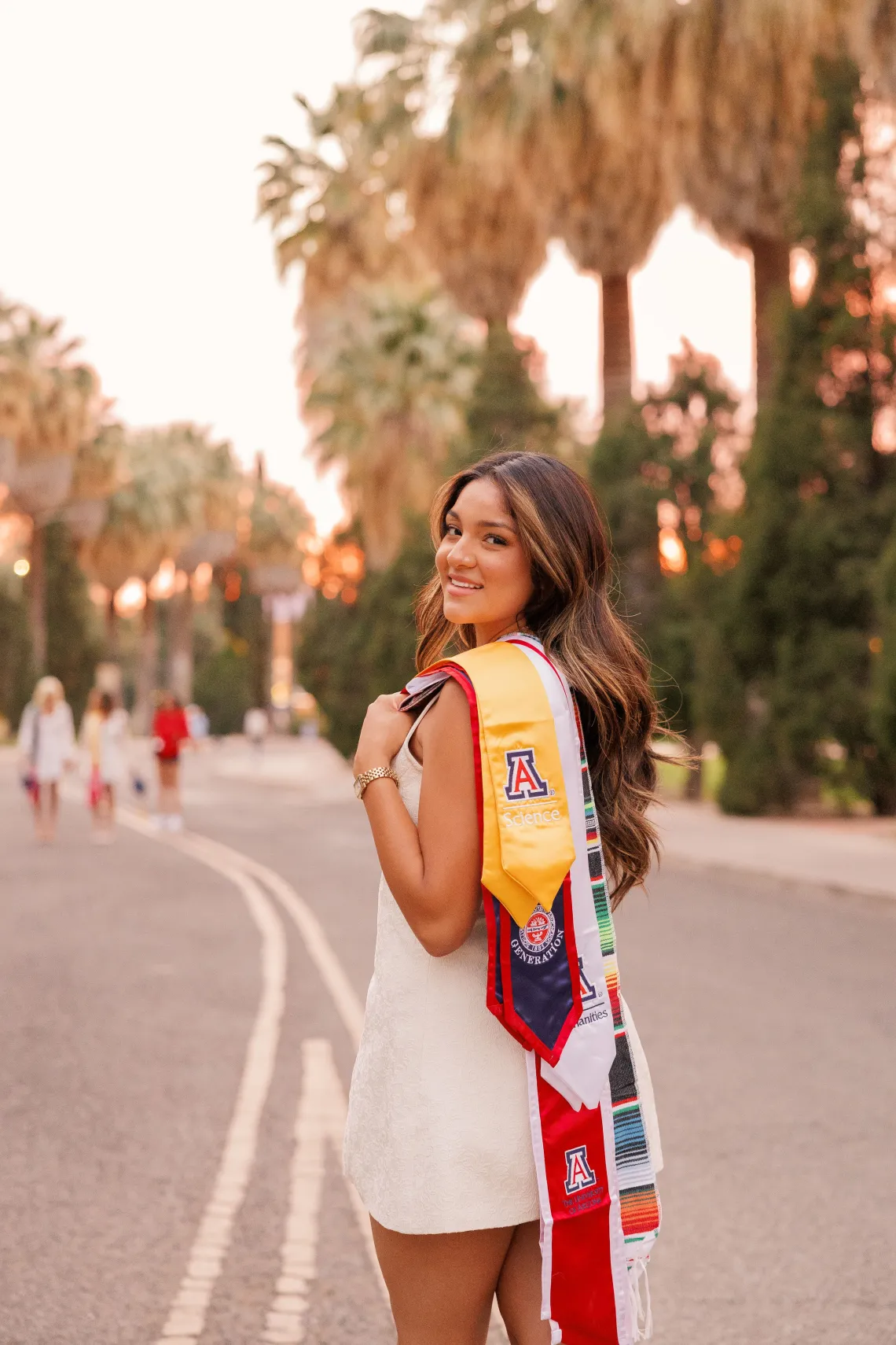 Lisette Montano holding a graduation cap