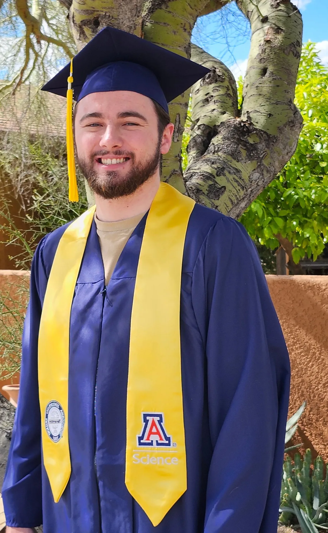 Skyler Tilden wearing graduation cap and gown