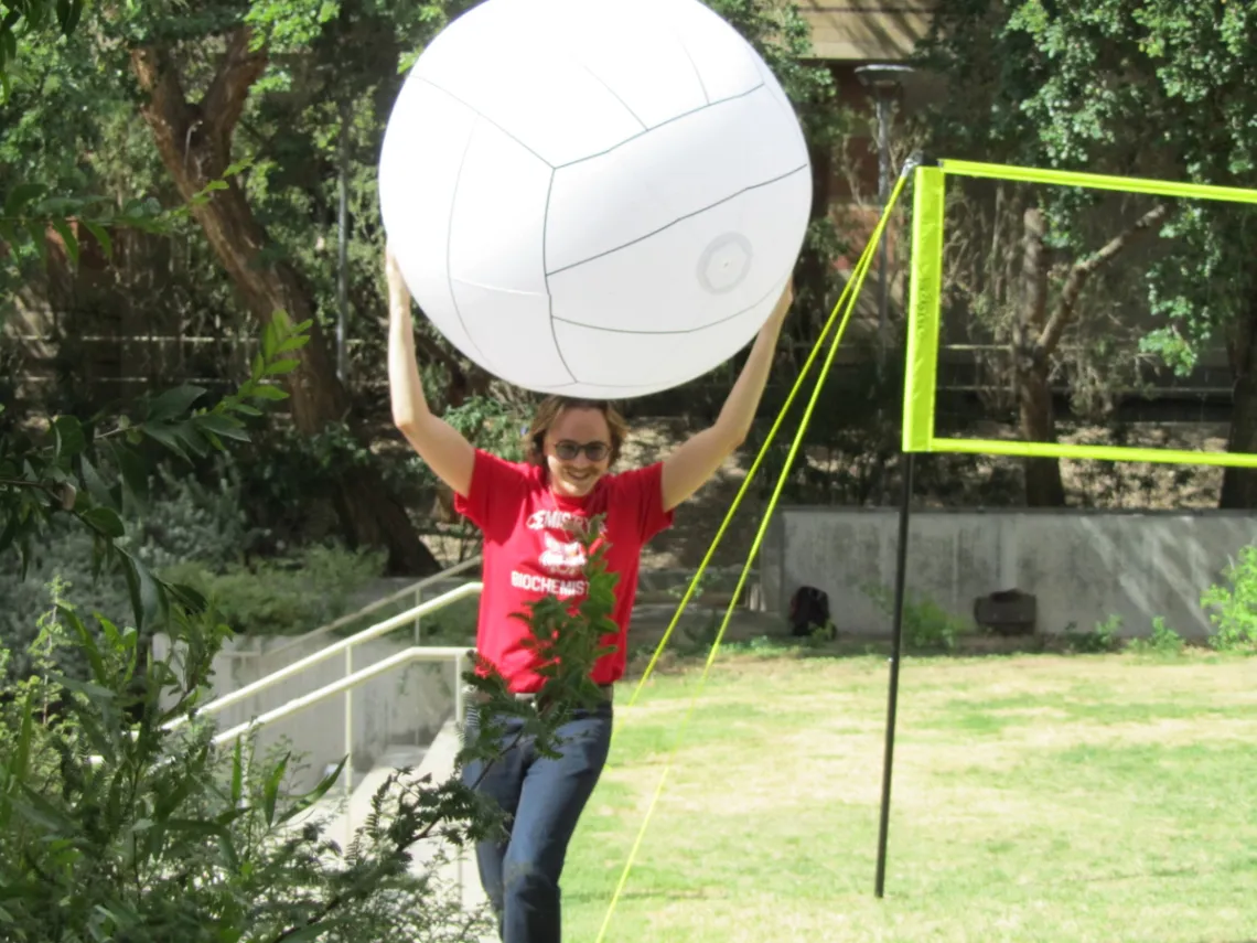 Student Ambassador holding large volleyball