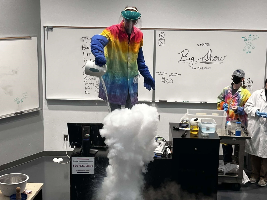 SMACS Club conducting experiment with thick white smoke