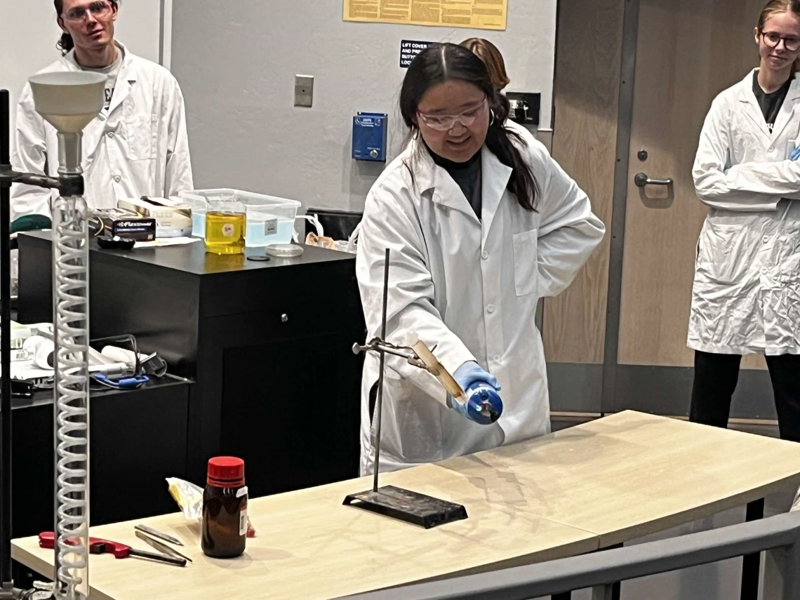 SMACS Club conducting experiment over a lab table