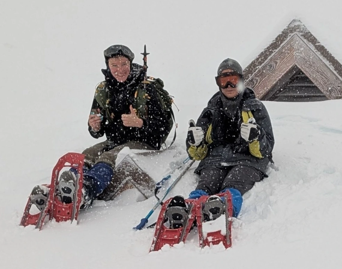 Anna Campbell and Ika Lin on snow sleds