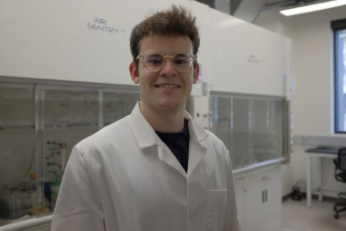 Dominic Dobai Smiling in a lab
