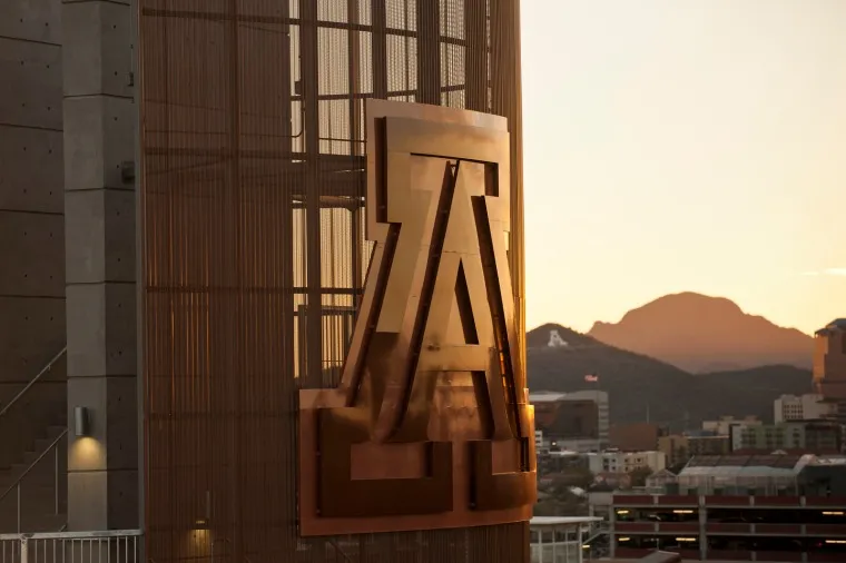 Photo of University of Arizona "A" on side of building with A Mountain in the background