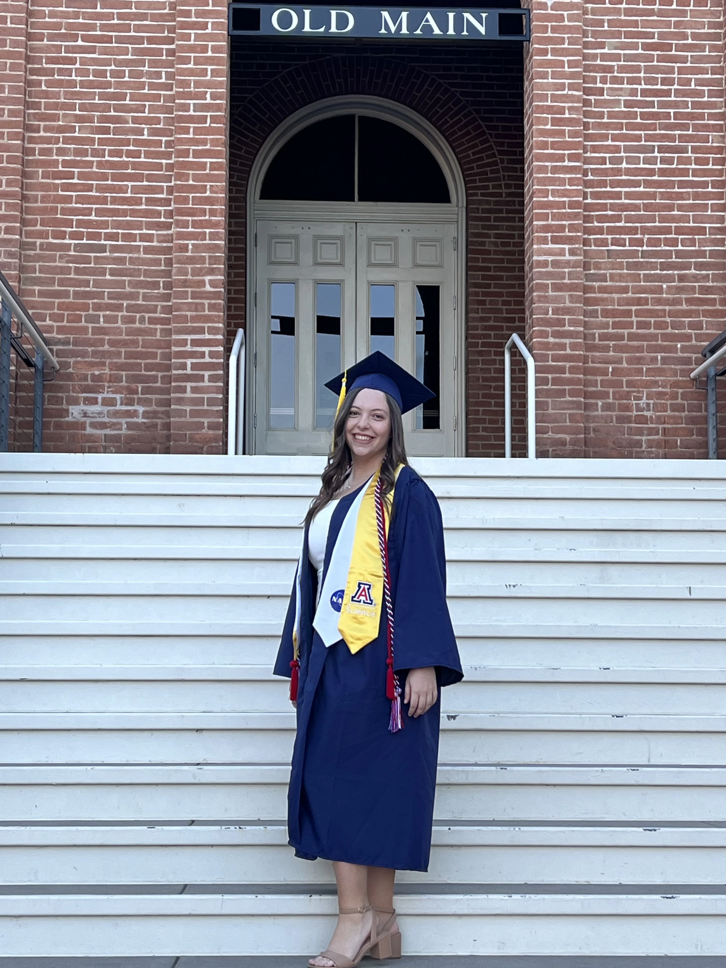 Kristen Roehling wearing a graduation cap and gown